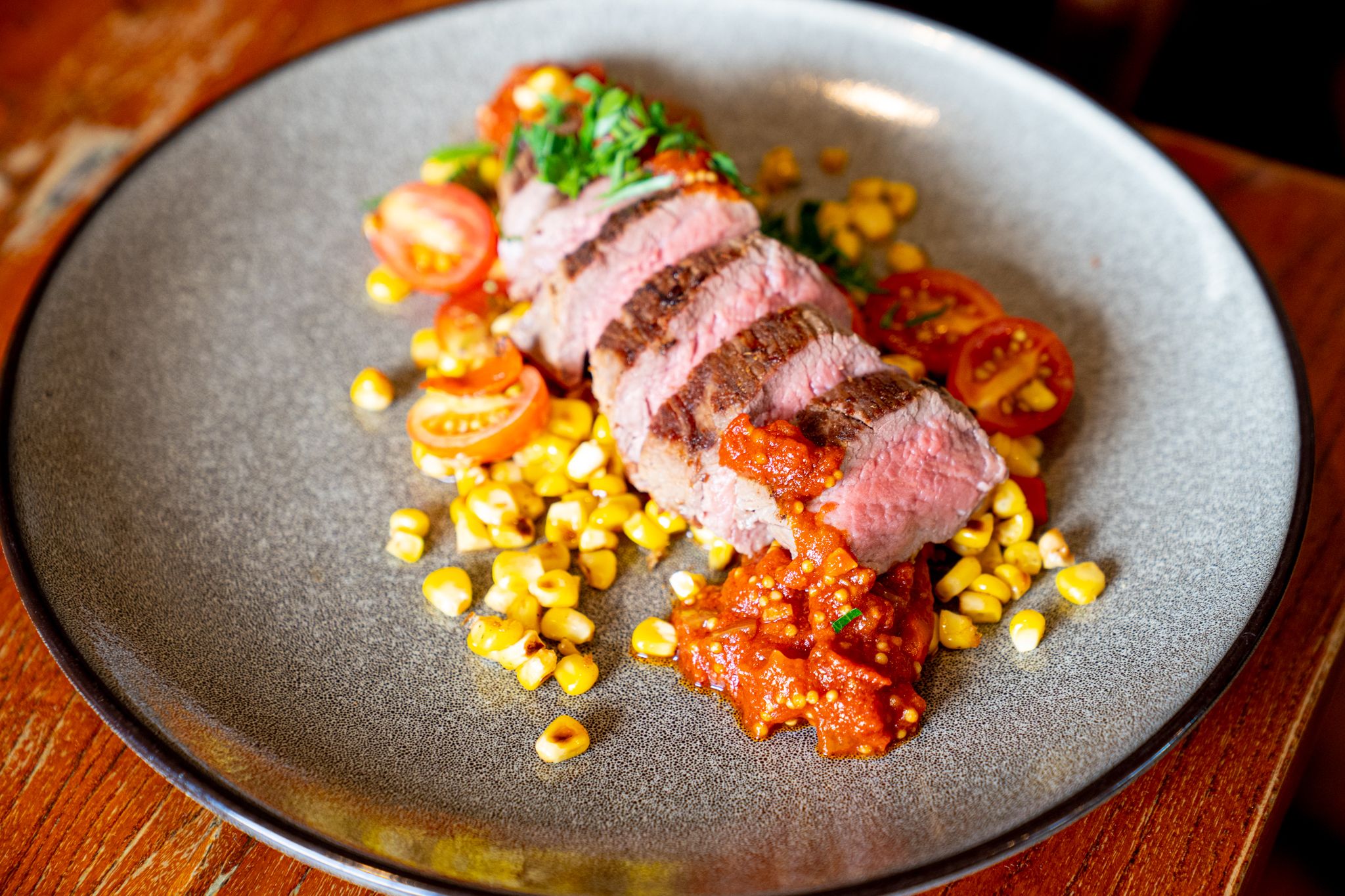 Chermoula Steak, grilled corn salsa